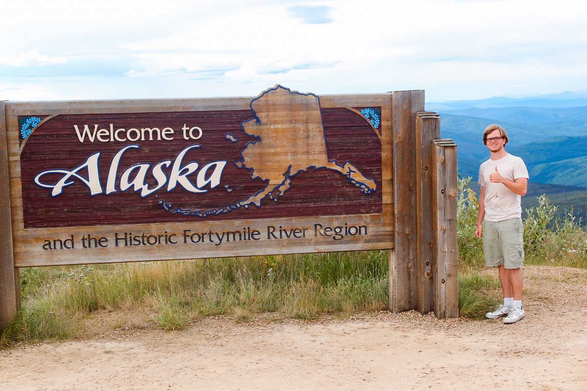 "Welcome to Alaska" on a sign at the border to Canada